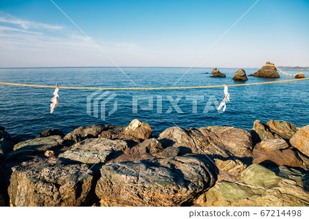 Meoto Iwa Rocks and blue sea in Ise, Mie, Japan Meoto Iwa Rocks and blue sea in Ise, Mie, Japan 67214498