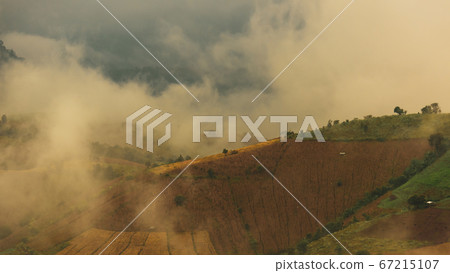 Beautiful landscape view of rice terraces and house on mountains beautiful shape in nature at pa-pong-peang rice terrace north Thailand.The village is in a valley among the rice terraces. Terraced Pad 67215107