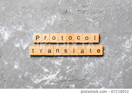 PROTOCOL translate word written on wood block. PROTOCOL translate word written on wood block. 67218052