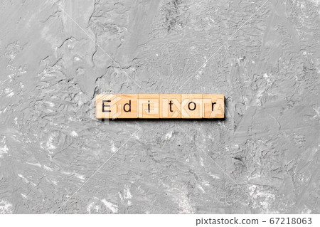 editor word written on wood block. editor text on editor word written on wood block. editor text on 67218063