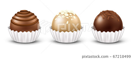 Set of chocolate candies with different toppings 67218499