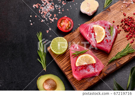 Fresh tuna fillet steaks with spices and herbs on Fresh tuna fillet steaks with spices and herbs on 67219716