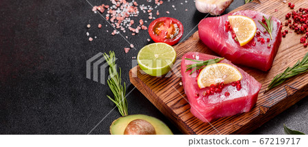 Fresh tuna fillet steaks with spices and herbs on Fresh tuna fillet steaks with spices and herbs on 67219717