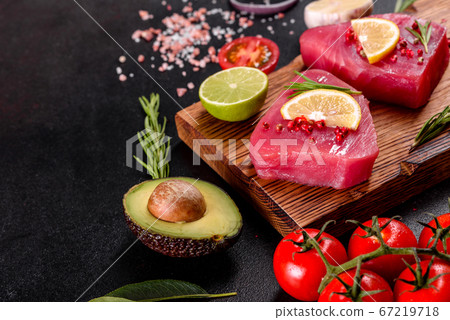 Fresh tuna fillet steaks with spices and herbs on Fresh tuna fillet steaks with spices and herbs on 67219718