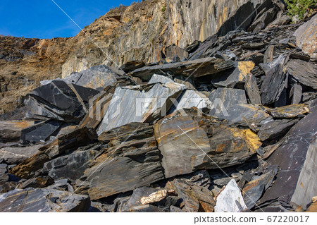 Slate mine garbaje rocks closeup bottom view 67220017