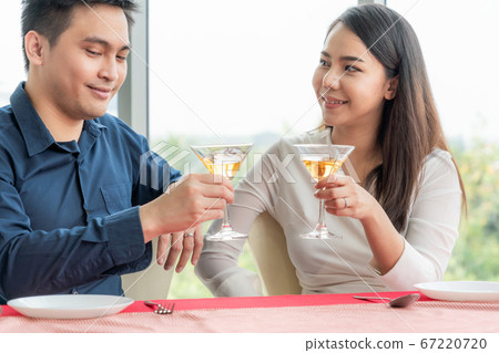 Happy romantic couple eating lunch at restaurant 67220720