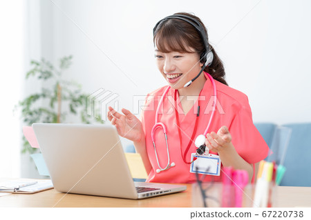 Young female doctor doing online medical treatment 67220738