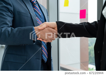 Business people handshake in corporate office Business people handshake in corporate office 67220944