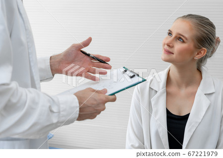 Doctor in professional uniform examining patient at hospital Doctor in professional uniform examining patient at hospital 67221979