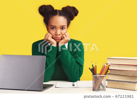 Headshot of tired afro teenage who wants to play Headshot of tired afro teenage who wants to play 67221981