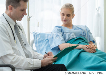 Doctor in professional uniform examining patient at hospital Doctor in professional uniform examining patient at hospital 67221982