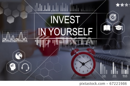 Invest In Yourself Phrase Over Background With Clock On Desk Invest In Yourself Phrase Over Background With Clock On Desk 67221986