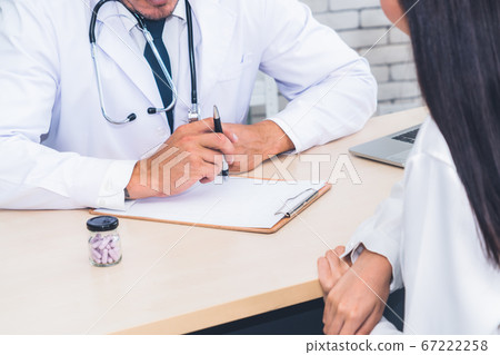 Doctor in professional uniform examining patient at hospital Doctor in professional uniform examining patient at hospital 67222258