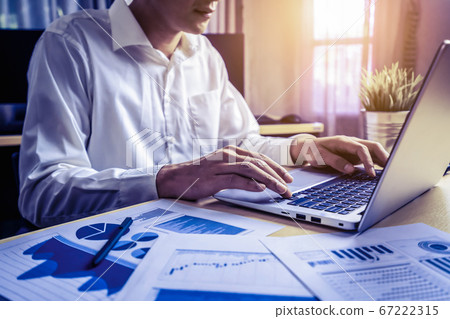 Businessman analyze data of stock market research. Businessman analyze data of stock market research. 67222315