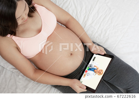 Doctor telemedicine service online video with pregnant woman for prenatal care Doctor telemedicine service online video with pregnant woman for prenatal care 67222616