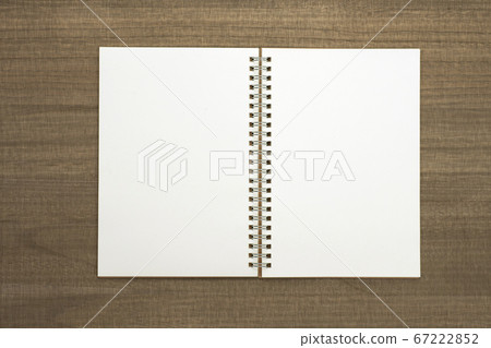 Sketchbook on a wooden table 67222852