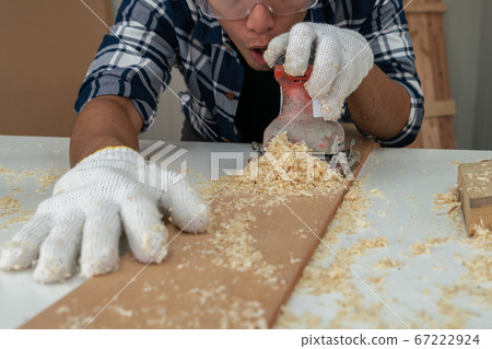 Carpenter working on wood craft at workshop Carpenter working on wood craft at workshop 67222924