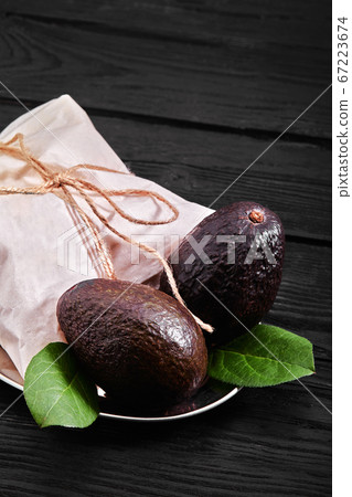 Ripe Haas Avocado Fruit. Alligator pear. Avocado with black peel. Foods for proper nutrition. Products for a diet. Ripe Haas Avocado Fruit. Alligator pear. Avocado with black peel. Foods for proper nutrition. Products for a diet. 67223674
