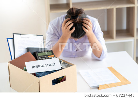 Businesswoman resigning from her job hold boxes 67224445