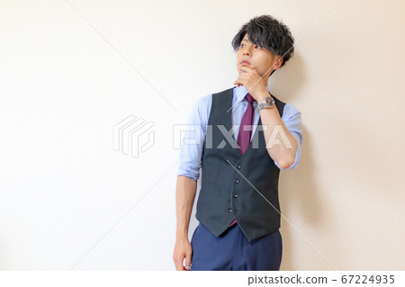 A member of society who rolls a suit and thinks 67224935
