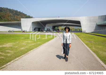 traveling woman walk at Xiangshan Visitor Center 67224985