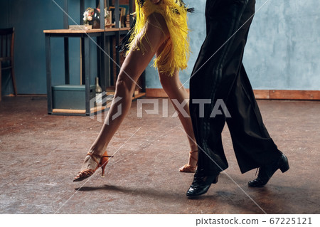 Ballroom dance samba. Close up of dancing legs of dancers. 67225121