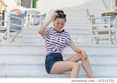 Summer city portrait fashionable teenage girl 15 years old in city 67225758
