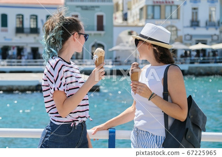Europe tourist travel cruise vacation, mother and daughter with ice cream 67225965
