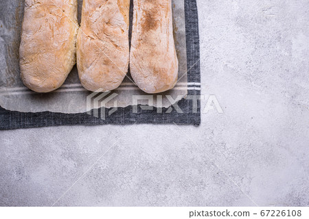 Homemade French baguettes with olive oil Homemade French baguettes with olive oil 67226108
