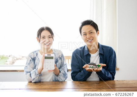 Mortgage image Young couple thinking about buying a home 67226267