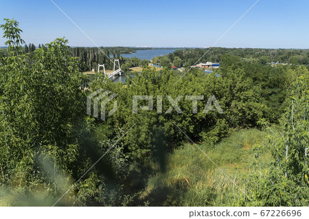 Panorama of top view of the river and the bridge, summer sunny day, bright natural colors of green trees 67226696