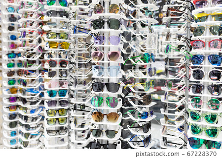 optics showcase with glasses for vision with a large selection of frames 67228370
