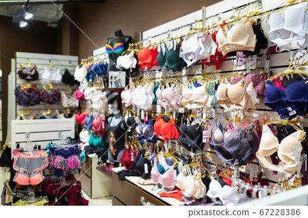 lingerie hanging on hangers in a shop window lingerie hanging on hangers in a shop window 67228386