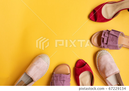 Stylish women shoes, sandals and flip flops in different colors. Beauty and fashion concept. 67229134