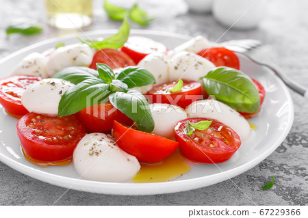 Caprese salad. Salad with mozzarella cheese fresh Caprese salad. Salad with mozzarella cheese fresh 67229366