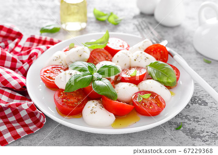 Caprese salad. Salad with mozzarella cheese fresh Caprese salad. Salad with mozzarella cheese fresh 67229368