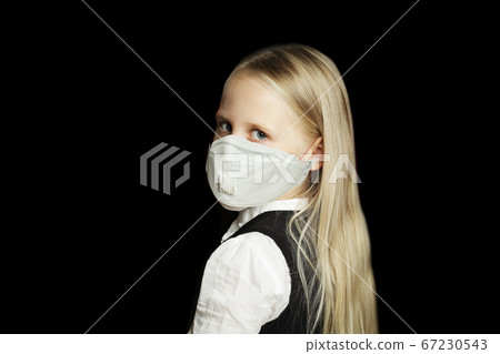 Little child girl student in protective medical mask 67230543