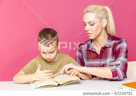 Remote education. Home education for children. Mom helps son to learn Remote education. Home education for children. Mom helps son to learn 67230781