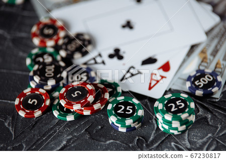 Legal rules for online gambling concept. Wooden gavel, money banknotes and playing cards on grey background Legal rules for online gambling concept. Wooden gavel, money banknotes and playing cards on grey background 67230817