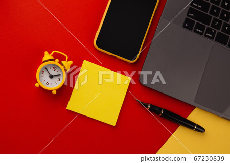 Creative home workplace with black pen, clcok and yellow sticky note, place for text. Work from home concept 67230839