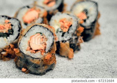 Traditional Japanese food, sushi and rolls. Ginger and wasabi, Chinese sticks. Rice and seafood food. Close up 67231684