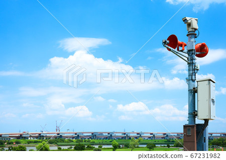 Disaster prevention administrative radio chime and blue sky on the Arakawa bank in the rainy season valley Disaster prevention administrative radio chime and blue sky on the Arakawa bank in the rainy season valley 67231982