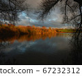 Picturesque lake shore in sunset tones 67232312