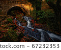 Old stone bridge with mountain stream 67232353
