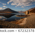 Mountain reservor with pumping station in dusk 67232378
