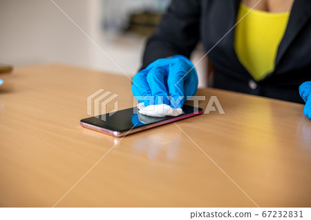 Woman's hand in blue gloves sanitizing cleaning Woman's hand in blue gloves sanitizing cleaning 67232831