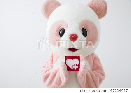 Costume panda that sends ale to medical staff with a heart-shaped panel Health and medical image 67234017