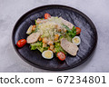Caesar salad with chicken breast on a dark plate. Home-made chicken fillet, cherry tomatoes 67234801