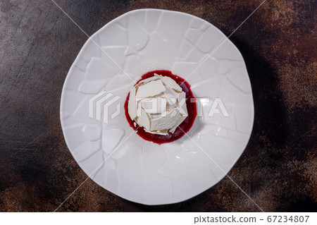 Meringue dessert. The combination of tender meringue, light protein and cream, juicy prunes and Meringue dessert. The combination of tender meringue, light protein and cream, juicy prunes and 67234807