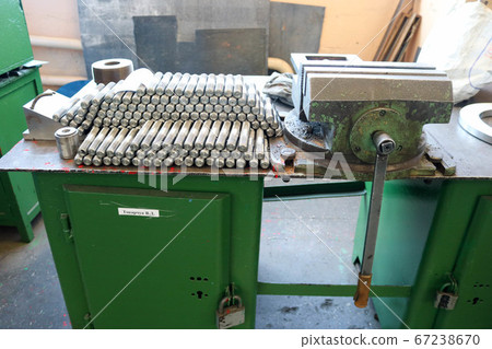 Many shiny metal studs with carving, nuts 67238670